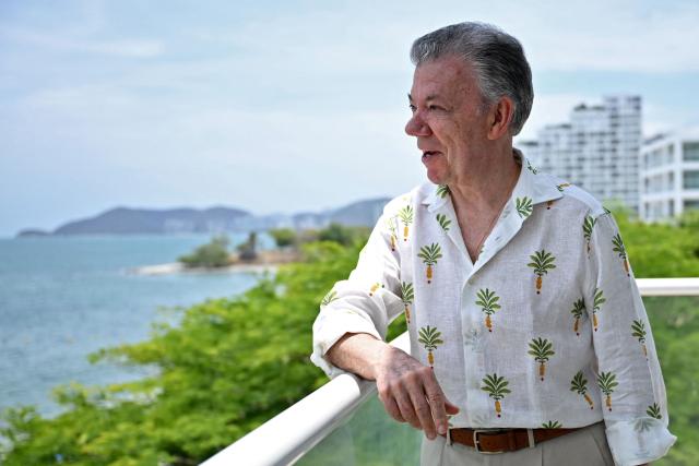 Colombia's former president (2010-2018) Juan Manuel Santos speaks during an interview with AFP in the sidelines of the First Conference Transitioning away from Fossil Fuels at Port Beach in Santa Marta, on April 27, 2026. (Photo by Raul ARBOLEDA / AFP)