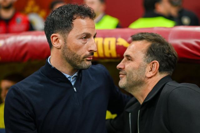 Fenerbahce's Italian head coach Domenico Tedesco (L) embraces Galatasaray's Turkish head coach Okan Buruk (R) during the Turkish Super lig football match between Fenerbahce and Galatasaray at the Rams Park Stadium in Istanbul, on April 26, 2026. Turkish club Fenerbahçe sacked their coach, the Italian-German Domenico Tedesco, on April 27, 2026, a day after a disastrous 3-0 derby defeat in the league against league leaders Galatasaray, a loss that crushed their last hopes of a title. "We have parted ways with our coach Domenico Tedesco," Fenerbahçe wrote in a statement. The club trails their arch-rivals Galatasaray by seven points with three matches remaining in the season. (Photo by Yasin AKGUL / AFP)