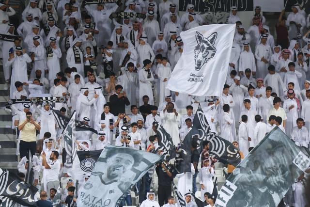 Sadd fans cheer during the Qatar Stars League match between Al-Sadd and Al-Shamal at Jassim Bin Hamad Stadium in Doha on April 27, 2026. (Photo by Karim JAAFAR / AFP)