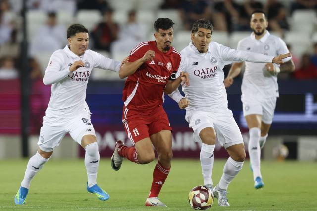 Sadd's Brazilian forward #09 Roberto Firmino vies for the ball with Shamal's forward #11 Baghdad Bounedjah during the Qatar Stars League match between Al-Sadd and Al-Shamal at Jassim Bin Hamad Stadium in Doha on April 27, 2026. (Photo by Karim JAAFAR / AFP)