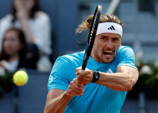 Germany's Alexander Zverev returns the ball to France's Terence Atmane during their 2026 ATP Tour Madrid Open tennis tournament third round singles match at the Caja Magica in Madrid, on April 27, 2026. (Photo by OSCAR DEL POZO / AFP)