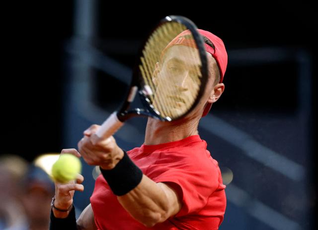 France's Terence Atmane returns the ball to Germany's Alexander Zverev during their 2026 ATP Tour Madrid Open tennis tournament third round singles match at the Caja Magica in Madrid, on April 27, 2026. (Photo by OSCAR DEL POZO / AFP)