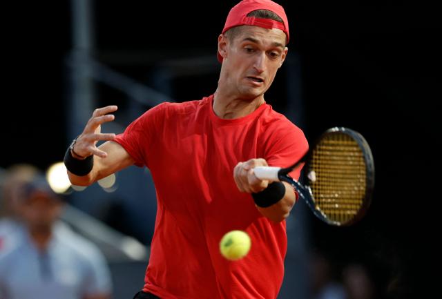 France's Terence Atmane returns the ball to Germany's Alexander Zverev during their 2026 ATP Tour Madrid Open tennis tournament third round singles match at the Caja Magica in Madrid, on April 27, 2026. (Photo by OSCAR DEL POZO / AFP)