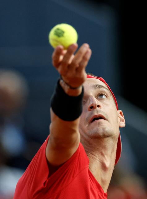 France's Terence Atmane serves to Germany's Alexander Zverev during their 2026 ATP Tour Madrid Open tennis tournament third round singles match at the Caja Magica in Madrid, on April 27, 2026. (Photo by OSCAR DEL POZO / AFP)