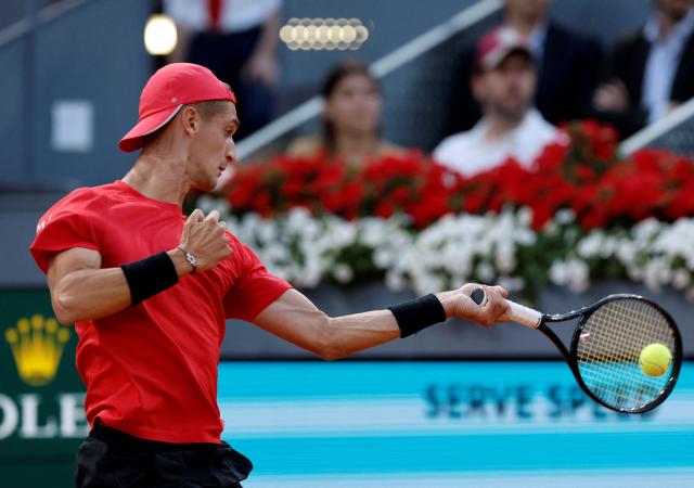 France's Terence Atmane returns the ball to Germany's Alexander Zverev during their 2026 ATP Tour Madrid Open tennis tournament third round singles match at the Caja Magica in Madrid, on April 27, 2026. (Photo by OSCAR DEL POZO / AFP)