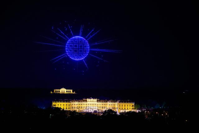 A graphic is formed using 3000 drones over Schonbrunn Palace during a drone show to mark the opening of Eurovision 2026 Song Contest in Vienna on April 27, 2026. (Photo by MAX SLOVENCIK / APA / AFP) / Austria OUT