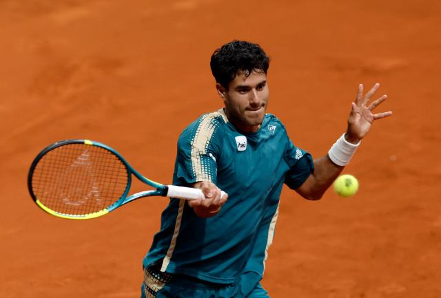 Paraguay's Adolfo Daniel Vallejo returns the ball to Italy's Flavio Cobolli during their 2026 ATP Tour Madrid Open tennis tournament third round singles match at the Caja Magica in Madrid, on April 27, 2026. (Photo by OSCAR DEL POZO / AFP)