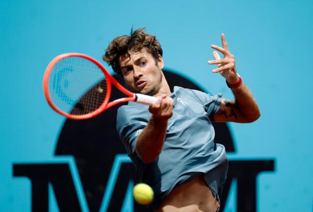 Italy's Flavio Cobolli returns the ball to Paraguay's Adolfo Daniel Vallejo during their 2026 ATP Tour Madrid Open tennis tournament third round singles match at the Caja Magica in Madrid, on April 27, 2026. (Photo by OSCAR DEL POZO / AFP)