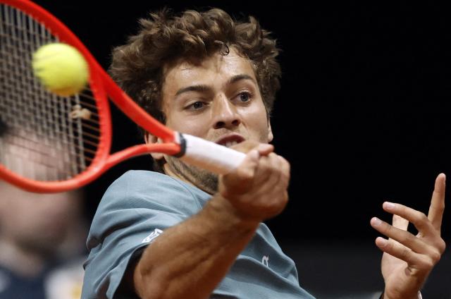 Italy's Flavio Cobolli returns the ball to Paraguay's Adolfo Daniel Vallejo during their 2026 ATP Tour Madrid Open tennis tournament third round singles match at the Caja Magica in Madrid, on April 27, 2026. (Photo by OSCAR DEL POZO / AFP)