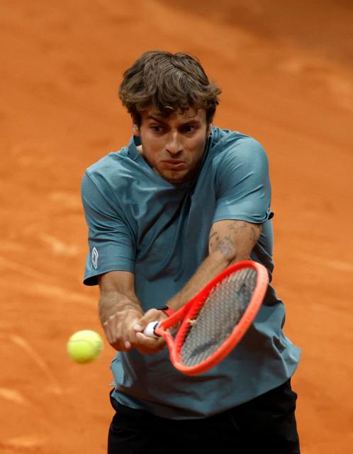 Italy's Flavio Cobolli returns the ball to Paraguay's Adolfo Daniel Vallejo during their 2026 ATP Tour Madrid Open tennis tournament third round singles match at the Caja Magica in Madrid, on April 27, 2026. (Photo by OSCAR DEL POZO / AFP)