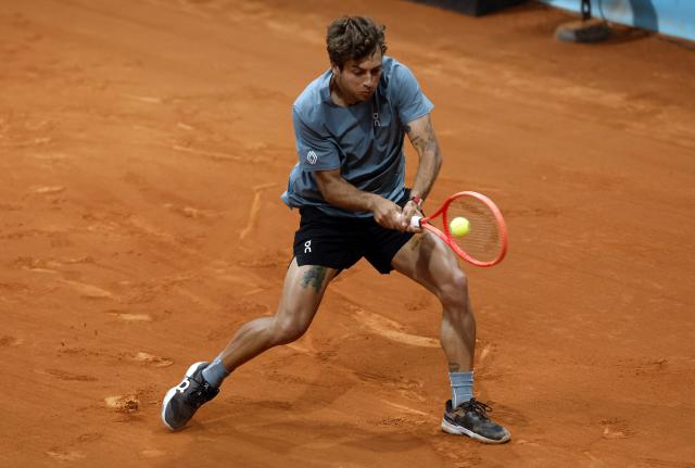 Italy's Flavio Cobolli returns the ball to Paraguay's Adolfo Daniel Vallejo during their 2026 ATP Tour Madrid Open tennis tournament third round singles match at the Caja Magica in Madrid, on April 27, 2026. (Photo by OSCAR DEL POZO / AFP)