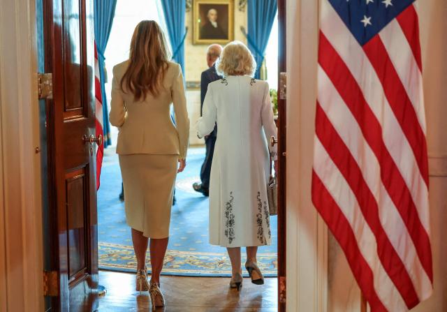 US First Lady Melania Trump walks with Britain's Queen Camilla at the White House in Washington, DC, on April 27, 2026. (Photo by Suzanne Plunkett / POOL / AFP)