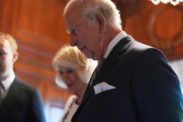 Britain's King Charles III (R) and Britain's Queen Camilla look over items to be placed in a time capsule in honor of the United States’ 250th anniversary in the Ambassador's Library room of the British Embassy in Washington, DC, on April 27, 2026. (Photo by Julia Demaree Nikhinson / POOL / AFP)