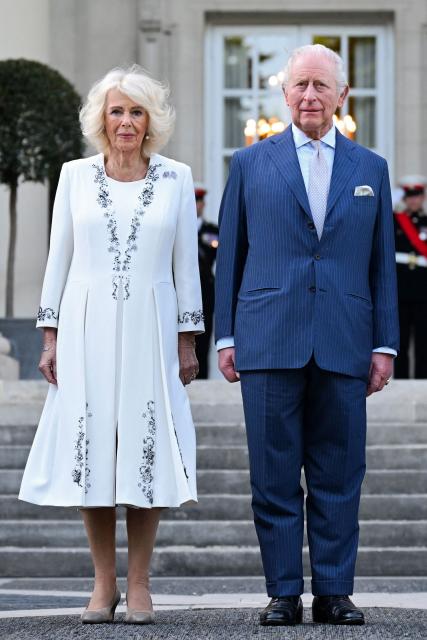 Britain's King Charles III and Britain's Queen Camilla attend a garden party at the British Ambassador's Residence in Washington, DC, on April 27, 2026. (Photo by Samir HUSSEIN / POOL / AFP)