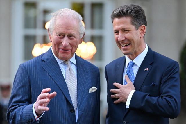 Britain's King Charles III laughs with British Ambassador to the US Christian Turner as they attend a garden party at the British Ambassador's Residence in Washington, DC, on April 27, 2026. (Photo by Samir HUSSEIN / POOL / AFP)