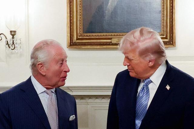 Britain's King Charles III chat with US President Donald Trump during his visit to the White House in Washington, DC, on April 27, 2026. (Photo by Suzanne Plunkett / POOL / AFP)