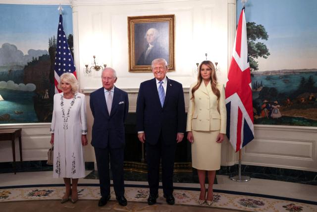 (L-R) Britain's Queen Camilla, Britain's King Charles III, US President Donald Trump and First Lady Melania Trump pose for photos during their visit to the White House in Washington, DC, on April 27, 2026. (Photo by Suzanne Plunkett / POOL / AFP)