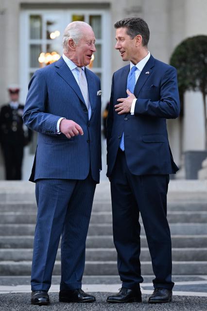 Britain's King Charles III speaks with British Ambassador to the US Christian Turner outside the British Embassy before attending a garden party at the British Ambassador's Residence in Washington, DC, on April 27, 2026. (Photo by Samir HUSSEIN / POOL / AFP)