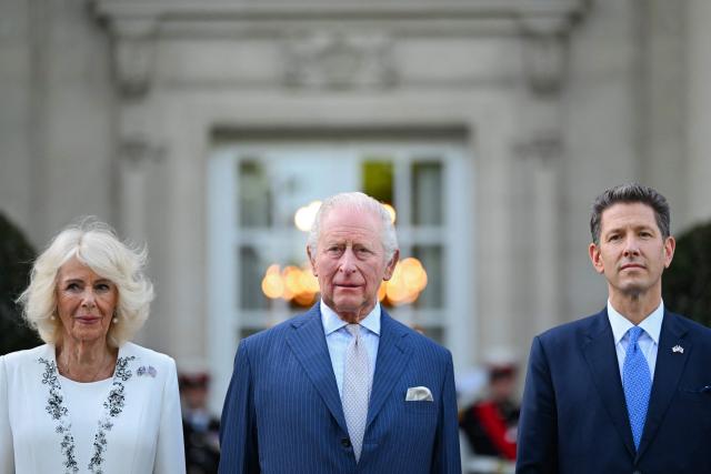Britain's King Charles III and Britain's Queen Camilla pose with British Ambassador to the US Christian Turner outside the British Embassy before attending a garden party at the British Ambassador's Residence in Washington, DC, on April 27, 2026. (Photo by Samir HUSSEIN / POOL / AFP)