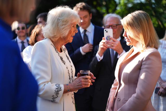Britain's Queen Camilla greets attendees of a garden party at the British Ambassador's Residence in Washington, DC, on April 27, 2026. (Photo by Julia Demaree Nikhinson / POOL / AFP)