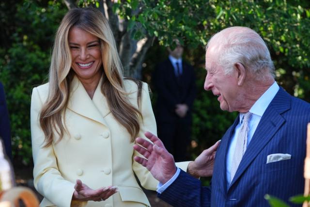 First Lady Melania Trump laughs with Britain's King Charles III as they tour the White House Beehive on the South Lawn of the White House in Washington, DC, on April 27, 2026. (Photo by Alex Brandon / POOL / AFP)