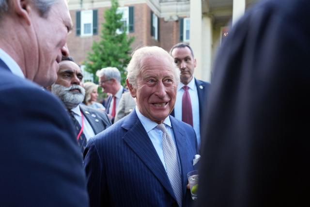 Britain's King Charles III greets attendees of a garden party at the British Ambassador's Residence in Washington, DC, on April 27, 2026. (Photo by Julia Demaree Nikhinson / POOL / AFP)