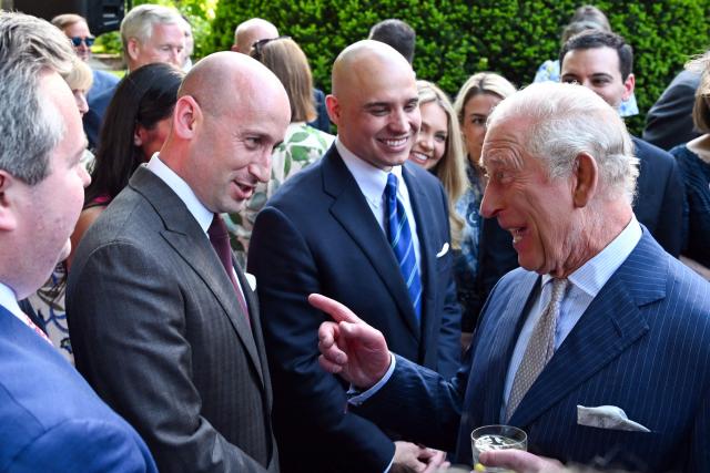 Britain's King Charles III speaks with the White House Deputy Chief of Staff for Policy Stephen Miller during a garden party at the British Ambassador's Residence in Washington, DC, on April 27, 2026. (Photo by Roberto Schmidt / POOL / AFP)