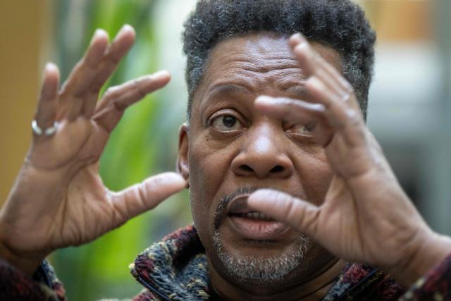 United States' saxophonist Ravi Coltrane gestures during an AFP interview ahead of a concert in honor of Miles Davis and John Coltrane, at which he will perform with trumpeter and composer Terence Blanchard in Wroclaw as part of the Jazz nad Odra festival on April 26, 2026. Awash in purple and turquoise stage lights, a century after the birth of two of jazz's most formidable legacies -- Miles Davis and John Coltrane -- Ravi Coltrane and Terence Blanchard are refusing to recreate the past. (Photo by Wojtek RADWANSKI / AFP)