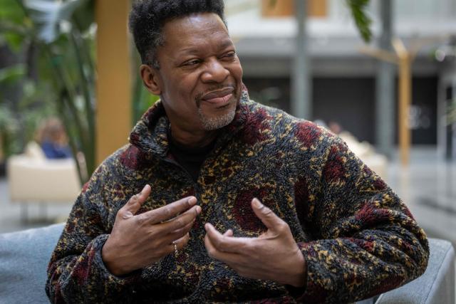 United States' saxophonist Ravi Coltrane gestures during an AFP interview ahead of a concert in honor of Miles Davis and John Coltrane, at which he will perform with trumpeter and composer Terence Blanchard in Wroclaw as part of the Jazz nad Odra festival on April 26, 2026. Awash in purple and turquoise stage lights, a century after the birth of two of jazz's most formidable legacies -- Miles Davis and John Coltrane -- Ravi Coltrane and Terence Blanchard are refusing to recreate the past. (Photo by Wojtek RADWANSKI / AFP)