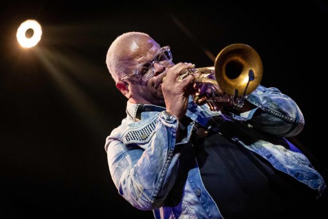 United States' trumpet player and composer Terence Blanchard performes on the stage of the Impart jazz club in Wroclaw during his concert with saxophonist Ravi Coltrane in honor of Miles Davis and John Coltrane as part of the Jazz nad Odra festival on April 26, 2026. Awash in purple and turquoise stage lights, a century after the birth of two of jazz's most formidable legacies -- Miles Davis and John Coltrane -- Ravi Coltrane and Terence Blanchard are refusing to recreate the past. (Photo by Wojtek RADWANSKI / AFP)
