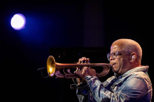 United States' trumpet player and composer Terence Blanchard performes on the stage of the Impart jazz club in Wroclaw during his concert with saxophonist Ravi Coltrane in honor of Miles Davis and John Coltrane as part of the Jazz nad Odra festival on April 26, 2026. Awash in purple and turquoise stage lights, a century after the birth of two of jazz's most formidable legacies -- Miles Davis and John Coltrane -- Ravi Coltrane and Terence Blanchard are refusing to recreate the past. (Photo by Wojtek RADWANSKI / AFP)