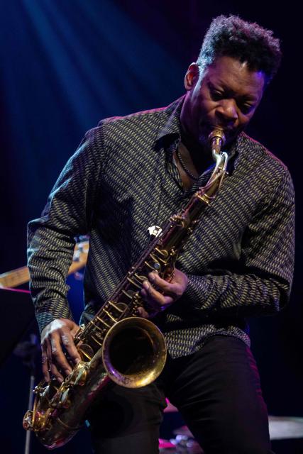 United States' saxophonist Ravi Coltrane performes on the stage of the Impart jazz club in Wroclaw during his concert with trumpeter and composer Terence Blanchard in honor of Miles Davis and John Coltrane as part of the Jazz nad Odra festival on April 26, 2026. Awash in purple and turquoise stage lights, a century after the birth of two of jazz's most formidable legacies -- Miles Davis and John Coltrane -- Ravi Coltrane and Terence Blanchard are refusing to recreate the past. (Photo by Wojtek RADWANSKI / AFP)