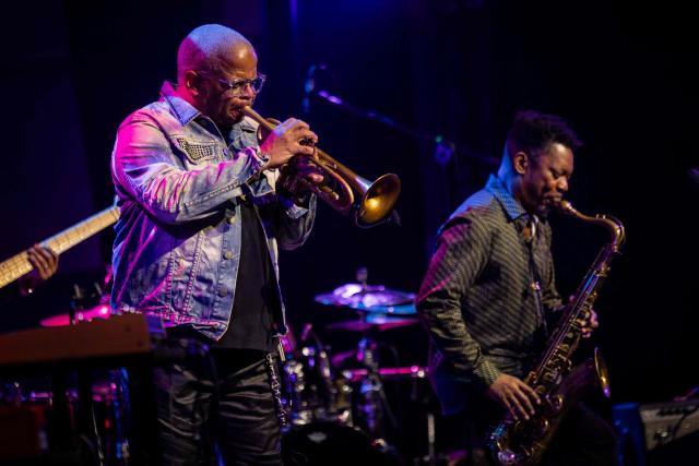 United States' trumpeter and composer Terence Blanchard (L) and saxophonist Ravi Coltrane (R) perform on the stage of the Impart jazz club in Wroclaw during a concert in honor of Miles Davis and John Coltrane as part of the Jazz nad Odra festival on April 26, 2026. Awash in purple and turquoise stage lights, a century after the birth of two of jazz's most formidable legacies -- Miles Davis and John Coltrane -- Ravi Coltrane and Terence Blanchard are refusing to recreate the past. (Photo by Wojtek RADWANSKI / AFP)