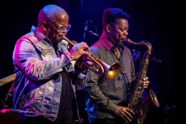 United States' trumpeter and composer Terence Blanchard (L) and saxophonist Ravi Coltrane (R) perform on the stage of the Impart jazz club in Wroclaw during a concert in honor of Miles Davis and John Coltrane as part of the Jazz nad Odra festival on April 26, 2026. Awash in purple and turquoise stage lights, a century after the birth of two of jazz's most formidable legacies -- Miles Davis and John Coltrane -- Ravi Coltrane and Terence Blanchard are refusing to recreate the past. (Photo by Wojtek RADWANSKI / AFP)