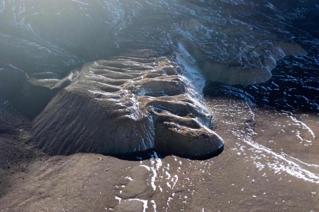 his aerial view shows fragments of a glacier in the Andes Mountains in Calingasta, San Juan province, Argentina, on April 22, 2026. (Photo by Luis ROBAYO / AFP)