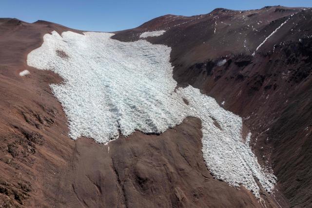 This aerial view shows the glacier known as Agua Negra in the Andes Mountains in Iglesia, San Juan province, Argentina, on April 23, 2026. (Photo by Luis ROBAYO / AFP)