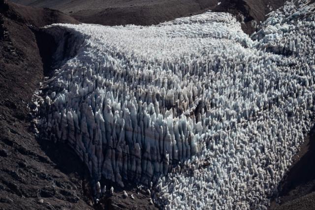 This aerial view shows a glacier in the Andes Mountains in Iglesia, San Juan province, Argentina,on April 23, 2026. (Photo by Luis ROBAYO / AFP)