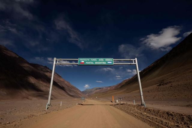View of the roadway showing the planned starting point of the project Agua Negra pass in Iglesia, San Juan province, Argentina, taken on April 23, 2026. The Agua Negra Pass (in Spanish: Paso de Agua Negra) is a pass over the Andes Mountains which connects Argentina and Chile. (Photo by Luis ROBAYO / AFP)
