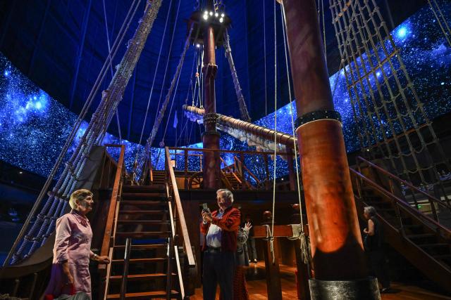 This photo taken on April 23, 2026 shows people visiting the Galeon Espiritu Santo, a full-scale representation of a 17th century galleon, on display at the Museo del Galeon in Manila. A full-size replica of a Spanish galleon stares out into Manila Bay, the centrepiece of a museum that will transport visitors back to the 17th century, when conscripted Philippine mariners birthed the era of globalisation. (Photo by Jam STA ROSA / AFP) / To go with AFP story Philippines-history-culture-Spain-shipping, FOCUS by Cecil MORELLA