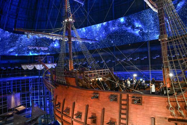 This photo taken on April 23, 2026 shows people visiting the Galeon Espiritu Santo, a full-scale representation of a 17th century galleon, on display at the Museo del Galeon in Manila. A full-size replica of a Spanish galleon stares out into Manila Bay, the centrepiece of a museum that will transport visitors back to the 17th century, when conscripted Philippine mariners birthed the era of globalisation. (Photo by Jam STA ROSA / AFP) / To go with AFP story Philippines-history-culture-Spain-shipping, FOCUS by Cecil MORELLA