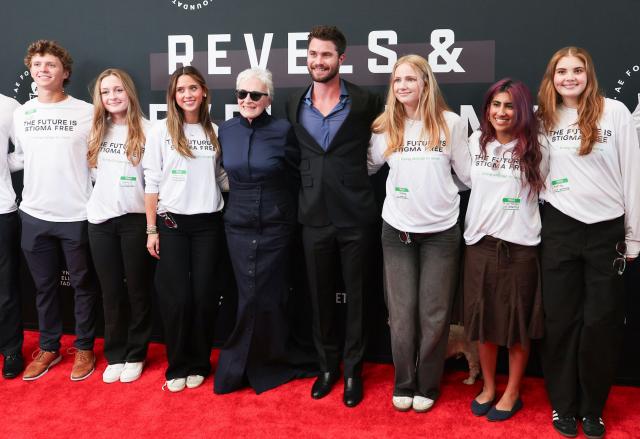 US actress Glenn Close and US actor Chase Stokes pose with volunteers as they attend non-profit organization Bring Change to Mind's "Revels and Revelations Celebration" at the Fort Mason Center for Arts and Culture in San Francisco, California, on April 27, 2026. (Photo by Christopher VICTORIO / AFP)