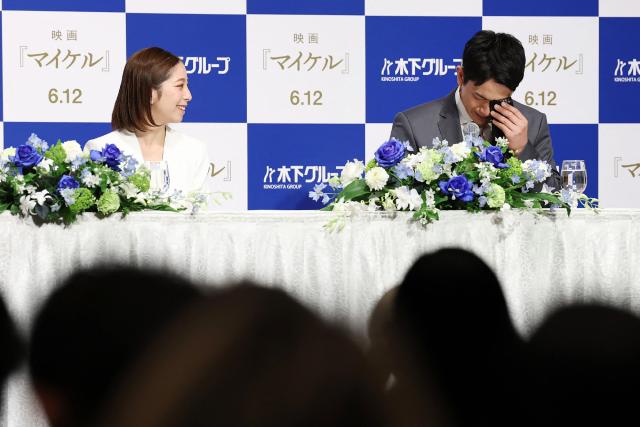 Figure skater Ryuichi Kihara (R) wipes away tears as his skating partner Riku Miura looks on at their retirement press conference in Tokyo on April 28, 2026. (Photo by JIJI Press / AFP) / Japan OUT