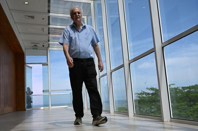 Brazilian scientist and meteorologist Carlos Nobre walks during an interview with AFP at the International Conference on the Just Transition Away from Fossil Fuels in Santa Marta, Colombia, on April 27, 2026. (Photo by Raul ARBOLEDA / AFP)