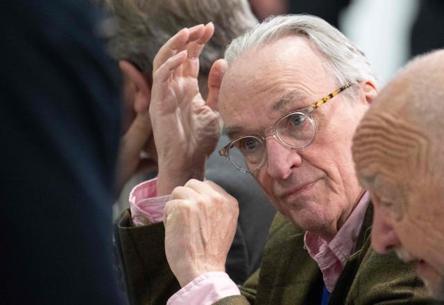 Defendant Prince Heinrich XIII Reuss waits in the courtroom for the continuation of the so-called "Reichsbuerger" trial against himself, a former MP and ex-army officers accused of masterminding a conspiracy theory-driven plot to attack the German parliament and topple the government, on April 28, 2026 in Frankfurt am Main, western Germany. In one of the biggest cases heard by German courts in decades, prosecutors accuse the group of preparing a "treasonous undertaking" to storm the Bundestag (German parliament) and take MPs hostage. The proceedings at the regional court in Frankfurt are the second of three trials against defendants linked to the putsch plan. Eight suspected members of the coup plot are taking the stand in Frankfurt, as well as one woman accused of supporting their efforts to overthrow then Chancellor Olaf Scholz's government. (Photo by Boris Roessler / POOL / AFP)