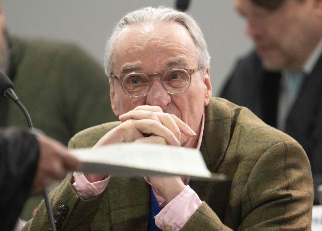 Defendant Prince Heinrich XIII Reuss waits in the courtroom for the continuation of the so-called "Reichsbuerger" trial against himself, a former MP and ex-army officers accused of masterminding a conspiracy theory-driven plot to attack the German parliament and topple the government, on April 28, 2026 in Frankfurt am Main, western Germany. In one of the biggest cases heard by German courts in decades, prosecutors accuse the group of preparing a "treasonous undertaking" to storm the Bundestag (German parliament) and take MPs hostage. The proceedings at the regional court in Frankfurt are the second of three trials against defendants linked to the putsch plan. Eight suspected members of the coup plot are taking the stand in Frankfurt, as well as one woman accused of supporting their efforts to overthrow then Chancellor Olaf Scholz's government. (Photo by Boris Roessler / POOL / AFP)