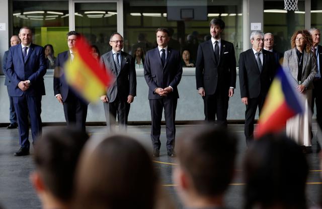 France's President and Co-Prince of Andorra Emmanuel Macron (C) poses alongside Prefect of the Provence-Alpes-Cote d'Azur region Georges-François Leclerc (2ndL), Andorra's Prime Minister Xavier Espot Zamora (3rdL) as he meets with students and teachers at a school in Santa Coloma, on the second day of his visit to the microstate of Andorra on April 28, 2026. (Photo by Valentine CHAPUIS / POOL / AFP)