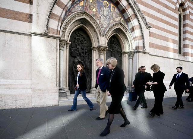 Sarah Mullally (C), Archbishop of Canterbury, walks past St. Paul Anglican church before her visit to Nafuma Refugee Centre in central Rome on April 28, 2026. (Photo by Filippo MONTEFORTE / AFP)