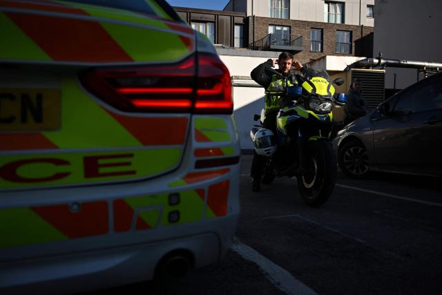 A motorcycle police officer arrives as Metropolitan Police interceptor teams and vehicles are prepared ahead of a patrol in central London on April 25, 2026. London's police force has invested heavily in clamping down on the phenomenon which has led the metropolis to be dubbed Europe's phone theft capital. (Photo by Ben STANSALL / AFP) / TO GO WITH Britain-police-theft-crime,REPORTAGE by Kimberley MANNION