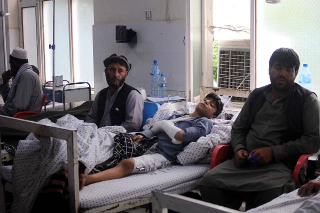 An Afghan boy receives medical treatment at a hospital after being injured in overnight Pakistani shelling in Asadabad, Kunar province on April 28, 2026. The Pakistani military killed at least seven civilians and wounded 85 others in an Afghan border province on April 27, a provincial health official said. (Photo by Aimal ZAHIR / AFP)