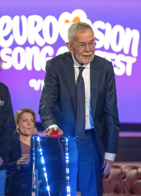 Austrian President Alexander Van Der Bellen pushes the red button to start a light show during the official opening of the stage prior to the 70th Eurovision Song Contest (ESC) at the Wiener Stadthalle in Vienna, Austria on April 28, 2026. Vienna will host the two semi-finals of the ESC taking place on May 12 and May 14 and the final on May 16, 2026. (Photo by Joe Klamar / AFP)